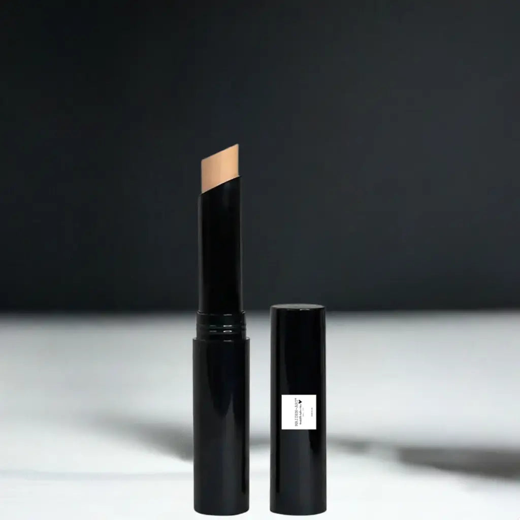 Beige concealer stick for smooth makeup coverage on a minimalist background.