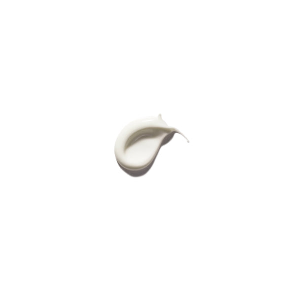 Day Dream pH Balancing Moisturizer texture sample on a white background, showcasing its creamy consistency.