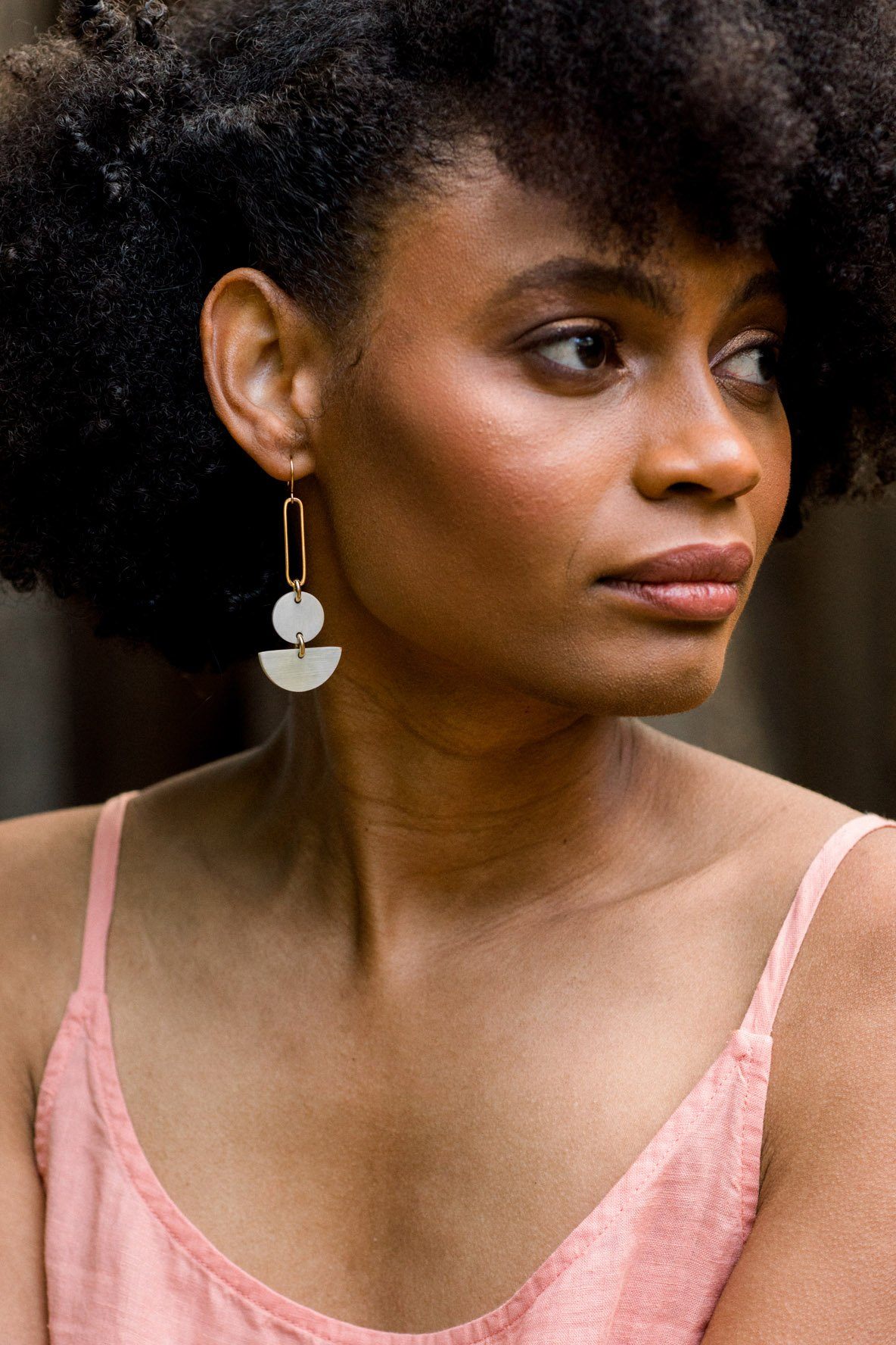 Buffalo Horn Geometric Earrings worn by a model, showcasing a stylish and bold natural-inspired design.